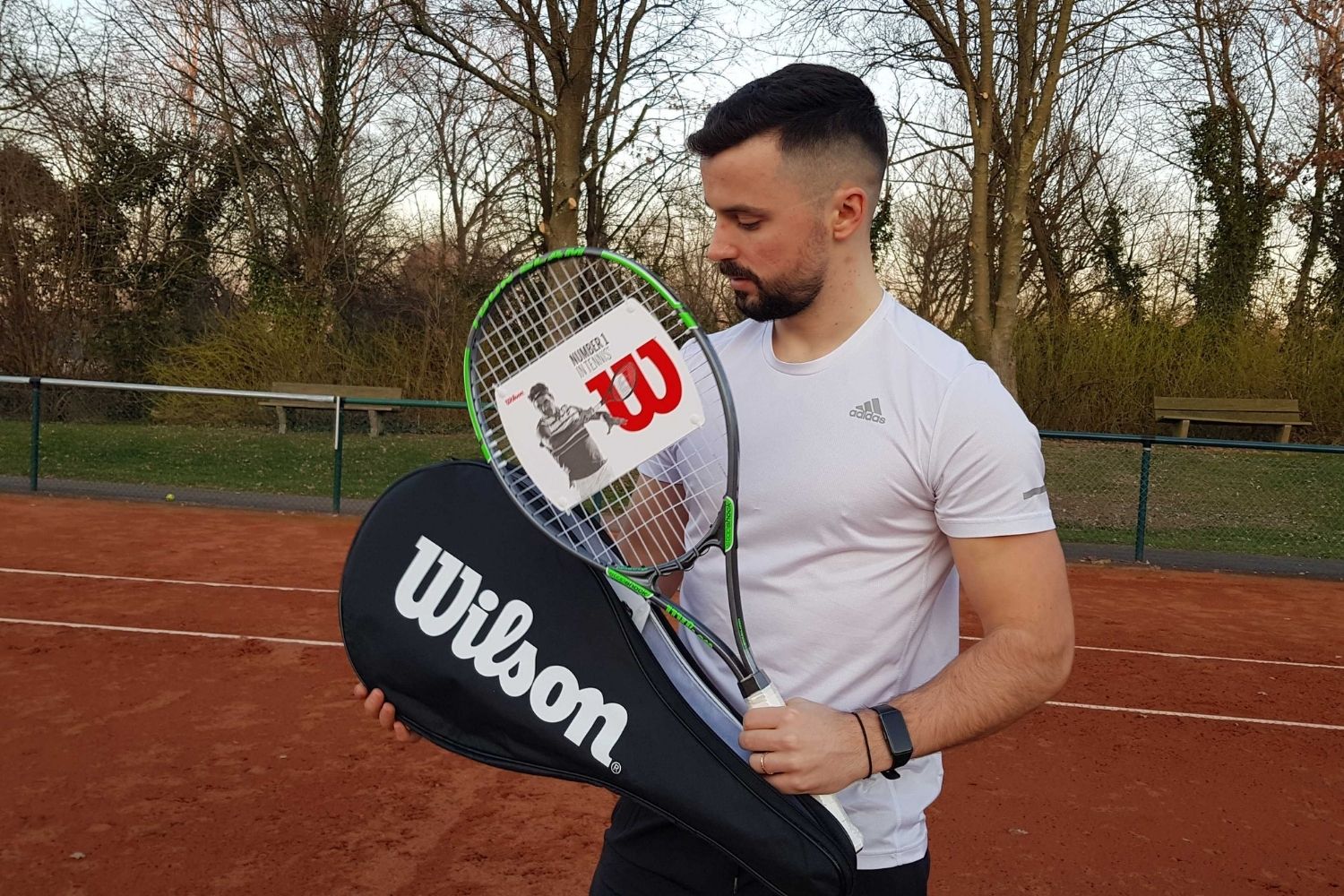 mario holding wilson the best tennis racket brand