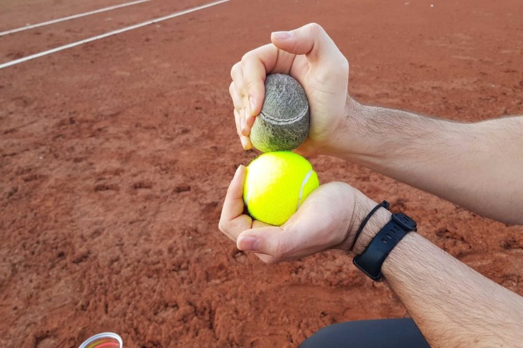 mario squeezing two pressureless tennis balls