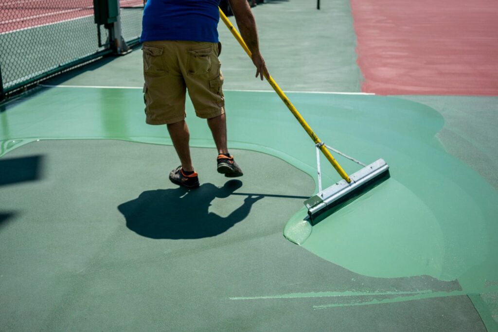 painting a tennis court