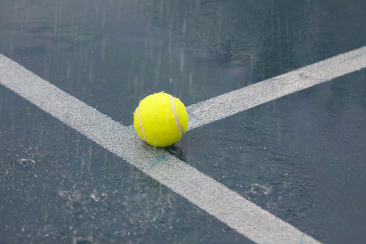 Playing Tennis in The Rain